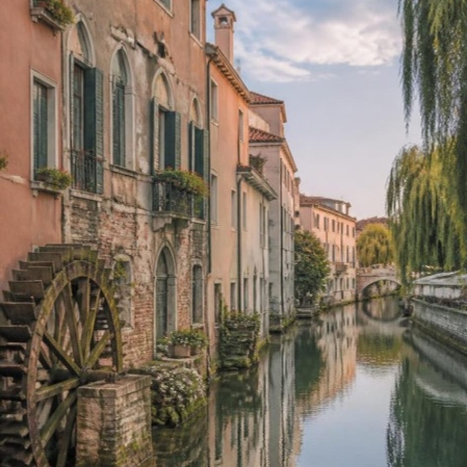 Canal, old houses and a waterwheel